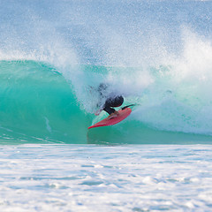 Image showing Surfer riding a perfect wave.