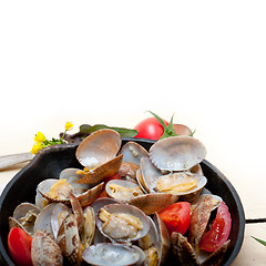 Image showing fresh clams on an iron skillet