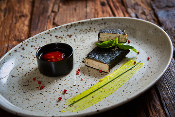 Image showing Tofu fried in nori. Served with sauce