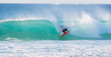 Image showing Surfer riding a perfect wave.