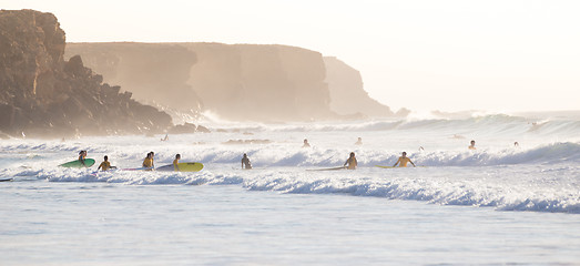 Image showing Surfers surfing on El Cotillo beach, Fuerteventura, Canary Islands, Spain.