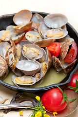 Image showing fresh clams on an iron skillet