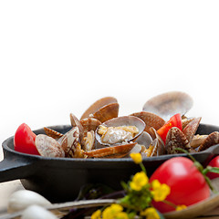 Image showing fresh clams on an iron skillet