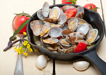 Image showing fresh clams on an iron skillet