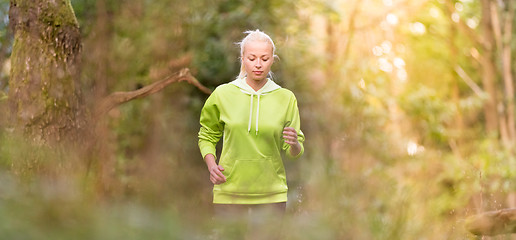 Image showing Pretty young girl runner in the forest. 