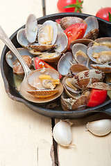 Image showing fresh clams on an iron skillet