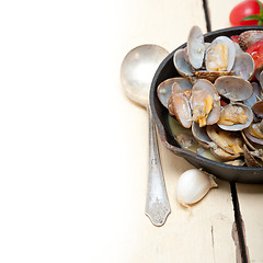 Image showing fresh clams on an iron skillet