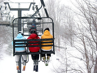 Image showing Skiers on chairlift