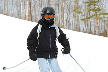 Image showing Girl skiing downhill