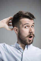 Image showing Portrait of young man with shocked facial expression