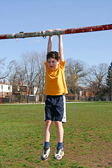 Image showing Boy hanging on