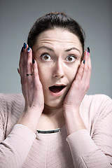 Image showing Portrait of young woman with shocked facial expression