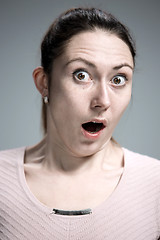 Image showing Portrait of young woman with shocked facial expression