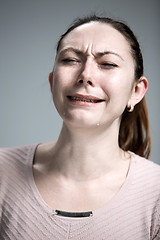 Image showing The crying woman with tears on face closeup