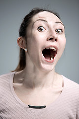 Image showing Portrait of young woman with shocked facial expression