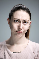 Image showing The portrait of a beautiful sad girl closeup