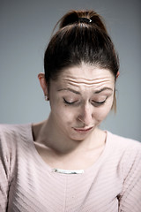 Image showing The portrait of a beautiful sad girl closeup