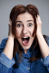 Image showing Portrait of young woman with shocked facial expression