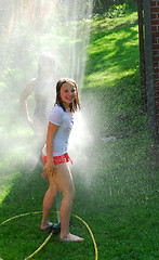 Image showing Girls and sprinkler