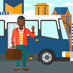 Image showing Man standing near bus.