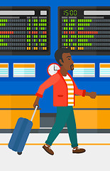 Image showing Man walking with suitcase.
