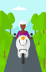Image showing Woman riding scooter.