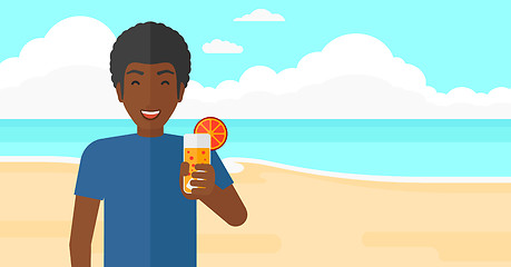 Image showing Tourist with cocktail on the beach.