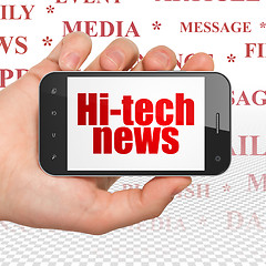 Image showing News concept: Hand Holding Smartphone with Hi-tech News on display