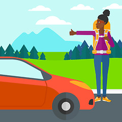 Image showing Young woman hitchhiking.