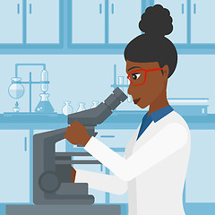 Image showing Laboratory assistant with microscope.