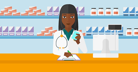 Image showing Pharmacist taking notes.