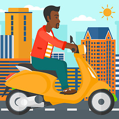 Image showing Man riding scooter.