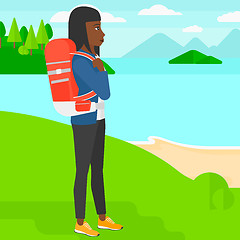Image showing Woman with backpack hiking.