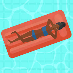 Image showing Woman relaxing in swimming pool.