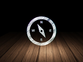 Image showing Vacation concept: Compass in grunge dark room