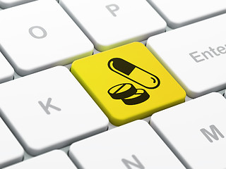 Image showing Health concept: Pills on computer keyboard background