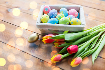 Image showing close up of colored easter eggs and flowers