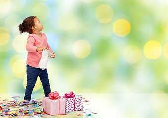 Image showing happy little baby girl with birthday presents