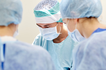 Image showing group of surgeons in operating room at hospital