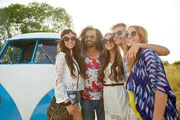 Image showing smiling young hippie friends over minivan car