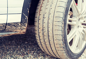 Image showing close up of dirty car wheel on ground