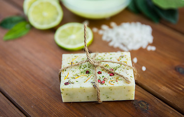 Image showing close up of handmade herbal soap bar on wood