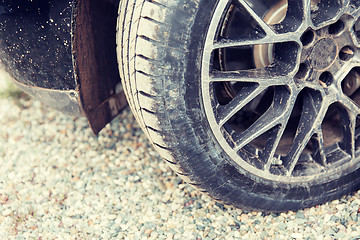 Image showing close up of dirty car wheel on ground