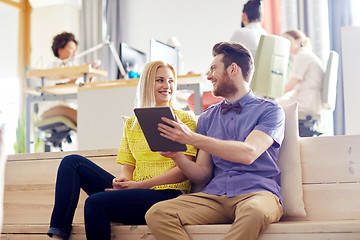 Image showing happy creative team with tablet pc in office