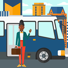 Image showing Woman standing near bus.