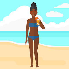 Image showing Tourist with cocktail on the beach.