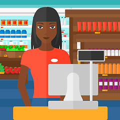 Image showing Saleslady standing at checkout.