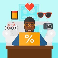 Image showing Man shopping online using his laptop.