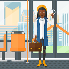 Image showing Woman standing inside public transport.