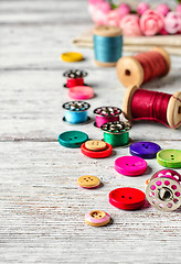 Image showing Buttons and spool of thread